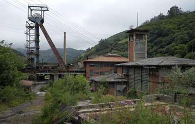 This photo taken on June 18, 2012, shows the abandoned mine of Figaredo, in Turon, near Oviedo. Spanish coal miners are staging nationwide protests actions organized by Unions against the cash-strapped government's decision to slash subsidies to the sector this year to 111 million euros ($142 million) from 301 million euros last year. Unions argue the subsidy cuts will lead to the closure of Spain's coal mines and the loss of up to 30,000 direct and indirect jobs, since Spanish coal relies on state aid to compete with cheaper imports. AFP PHOTO / MIGUEL RIOPA